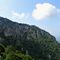 56 Vista sul versante nord roccioso_boscoso del Monte Suchello.JPG