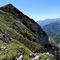 62 Il roccioso a precipizio versante nord del Monte Vetro con vista sulla valle di Roncobello.JPG