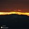 96 Il sole tramonta all_orizzonte tra le antenne di Valcava sul Linzone.JPG