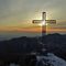 70 La bella croce di vetta Cornagera _1311 m_ baciata dal sole con vista verso Val Seriana.jpg