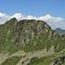 65 Zoom panoramico verso le Alpi Retiche tra il Pizzo del Vento _2241 m_ a sx e Foppone _2303 m_ a dx .jpg