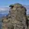 55 La rocciosa monolitica cima del Ponteranica occ. _2370 m_ con corvo nero su roccione.JPG