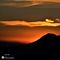 79 Da Costa Serina ammiriamo lo spettacolo del tramonto del sole che si abbassa sui monti Ubione e Linzone.JPG
