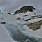 58 Laghetto di Pietra Quadra _2116 m_ in disgelo coperto da nuvoloni  .jpg